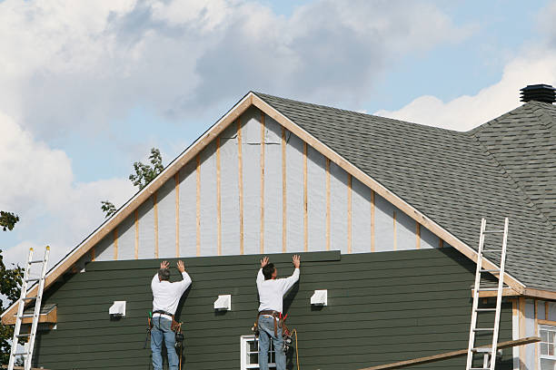 Professional Siding technician working in Andover, MA